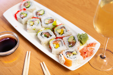 Japanese dish roll Urumaki with salmon, avocado, pepino and tobiko