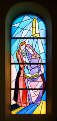 Saint Anne teaching her daughter, the Virgin Mary. A stained-glass window in the St James Church in Medjugorje, Bosnia and Herzegovina.