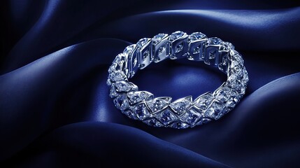 Fototapeta premium High-end diamond bracelet resting under a cool spotlight on a soft navy satin cloth