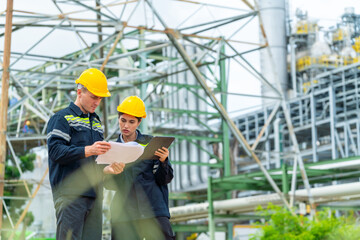 Petrochemical factory industry engineer teamwork meeting discussion at petroleum oil refinery...