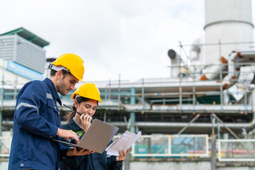 Petrochemical factory industry engineer teamwork meeting discussion at petroleum oil refinery...
