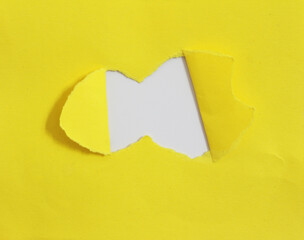rip hole paper on white background with space