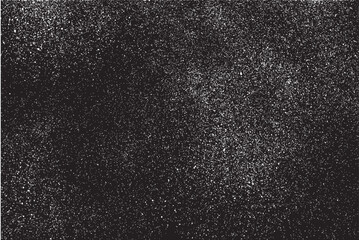 White grain spraying over black background creating subtle texture