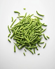 Fototapeta premium Fresh green beans piled artistically on a clean, white surface, showcasing their vibrant color and natural texture.