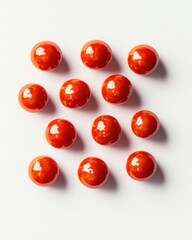 A vibrant arrangement of glossy red spheres on a clean white background.