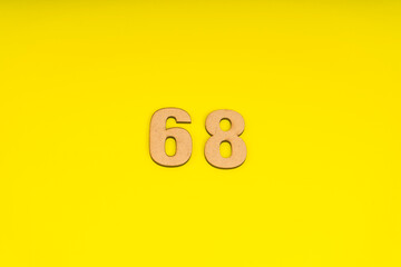 Number sixty-eight on yellow background