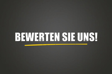 Bewerten Sie uns (Rate us) - A blackboard with white text.