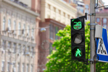 View of traffic light in city on sunny day. Space for text