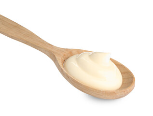 Tasty mayonnaise sauce in wooden spoon isolated on white