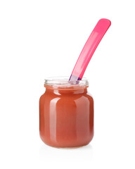 Baby food. Tasty puree in glass jar and spoon isolated on white