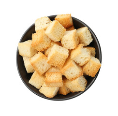 Delicious crispy croutons in bowl isolated on white, top view