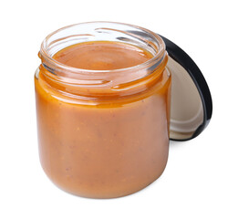 Tasty curry sauce in glass jar isolated on white