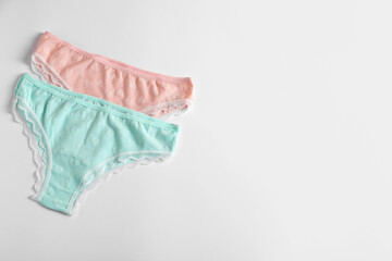 Women's underwear. Beautiful panties on white background, flat lay. Space for text