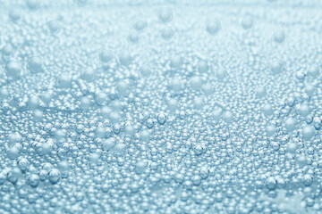 Soda water with bubbles as background, closeup