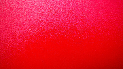 Textured Red Surface with Uneven Patterns and Shades