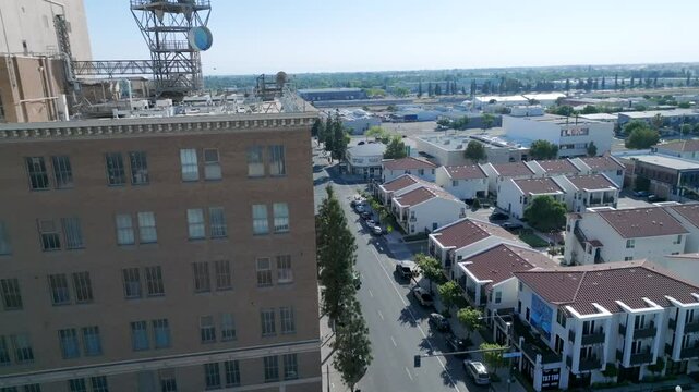 Drone view of downtown Fresno, California, showcasing its organized street grid, mid-rise structures