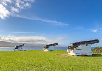 A view of the coastline near Wollongong with the cannons of Flagstaff Point Lighthouse in the foreground