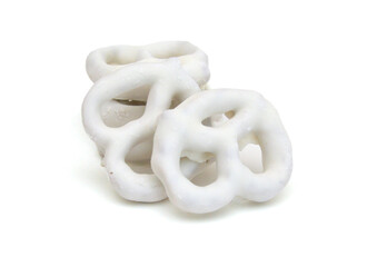 Colorful chocolate covered pretzels on white background