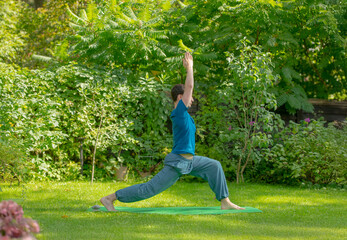 man meditating doing yoga exercises outdoors