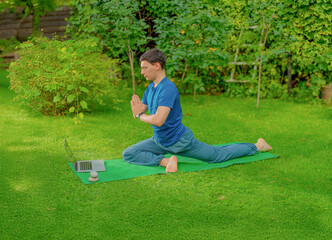 man meditating doing yoga exercises outdoors