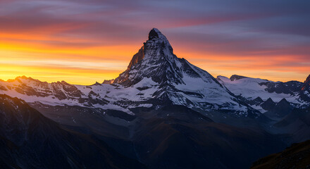 Majestic Mountain Peak at Sunrise with Dramatic Sky and Snowy Slopes