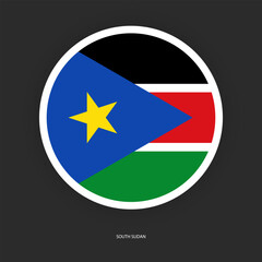 South Sudan circle flag icon with shadow on dark background. South Sudan button icon with white border isolated dark grey background	
