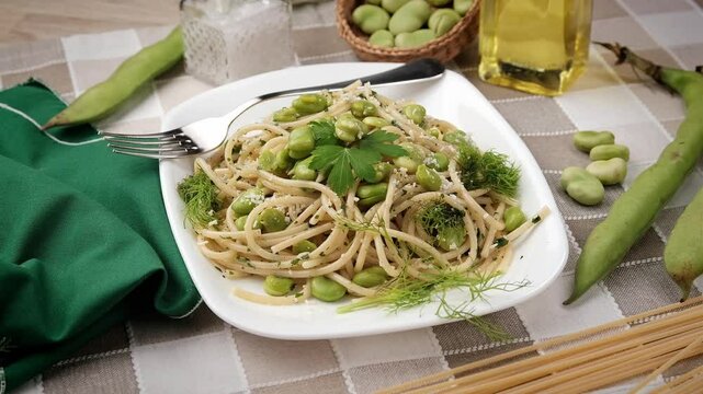 spaghetti with fresh broad beans - italian food - close up