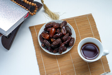 Overhead Shot Of Dates Fruit, Hot Tea And Holy Quran For Ramadan Concept