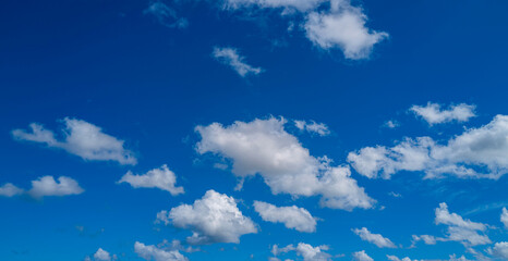 White clouds on blue sky. Beautiful sunny sky. Background with clouds on blue sky. Clouds on sky design.