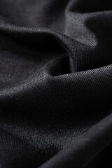 Fototapeta premium black cotton fabric texture background. Creases of cloth and cotton.