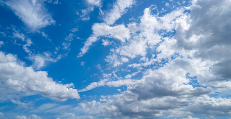 White clouds on blue sky. Beautiful sunny sky. Background with clouds on blue sky. Clouds on sky pattern.