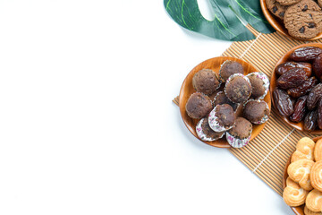 Flat Lay Of Various Cookies And Cakes With Dates Fruit On White Background