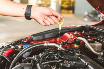 Man service mechanic maintenance inspection service maintenance car Check engine oil level car in...