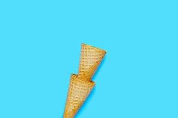 Waffle cones on blue background