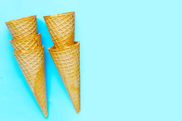 Waffle cones on blue background