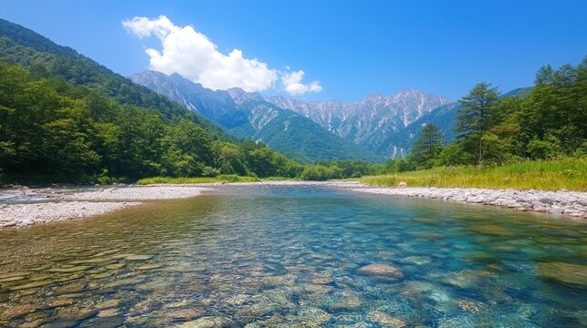 A mountain stream with crystal-clear water flowing over smooth stones.