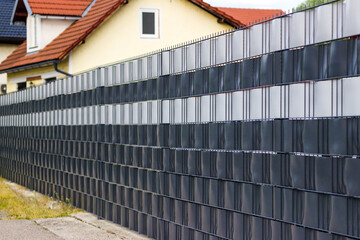 mesh panel fence with PVC privacy strips. wire panel fence with woven PVC slats