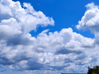 white clouds with clear blue sky