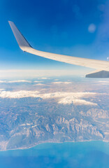 View from the airplane window of the mountains and sea resort with corals in Egypt, Sharm El Sheikh.Flight