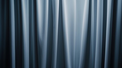 Obraz premium A close-up of elegant, flowing curtains in soft blue tones, creating a serene and calming atmosphere.