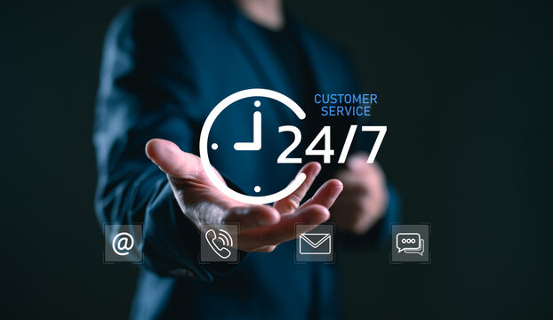 Businessman offering 24/7 customer service with communication icons. Concept of nonstop support, online assistance, and global business communication anytime, anywhere.
