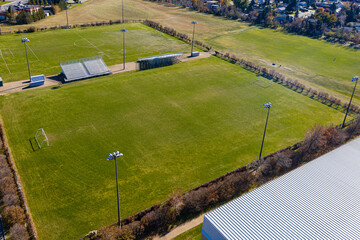 Large field with a stadium in the background