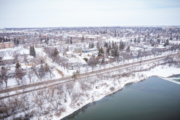 Snowy city with a river running through it
