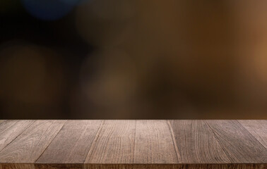 Empty wood table top and blur of restaurant background selective focus product display