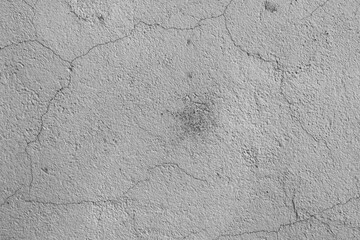 A weathered, time-damaged grey wall.