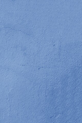 Surface of a blue painted concrete wall.