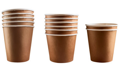 A stack of brown paper cups of varying heights, showcasing their cylindrical shape and smooth surface.
