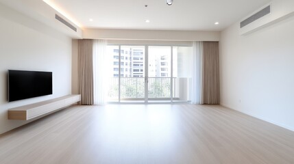 Modern, empty living room with large windows
