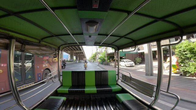 Bangkok, Thailand - 20 April 2025: View from inside a "Rot Song Thaeo", a type of shared taxi or minibus, traveling along Borommaratchachonnani Road in the Pinklao area.