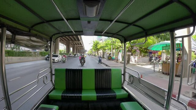 Bangkok, Thailand - 20 April 2025: View from inside a "Rot Song Thaeo", a type of shared taxi or minibus, traveling along Borommaratchachonnani Road in the Pinklao area.